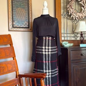 Black silky blouse. Very light. Little use